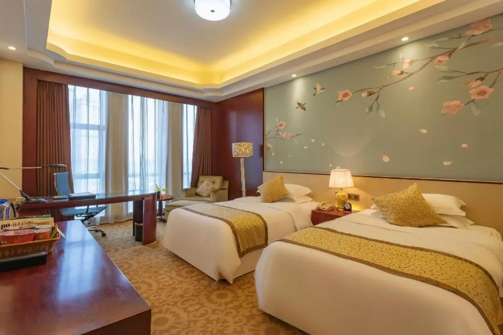 Bed in Dezhou Regal Kangbo Hotel