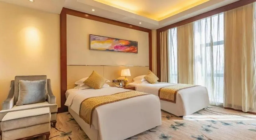 Bed in Dezhou Regal Kangbo Hotel