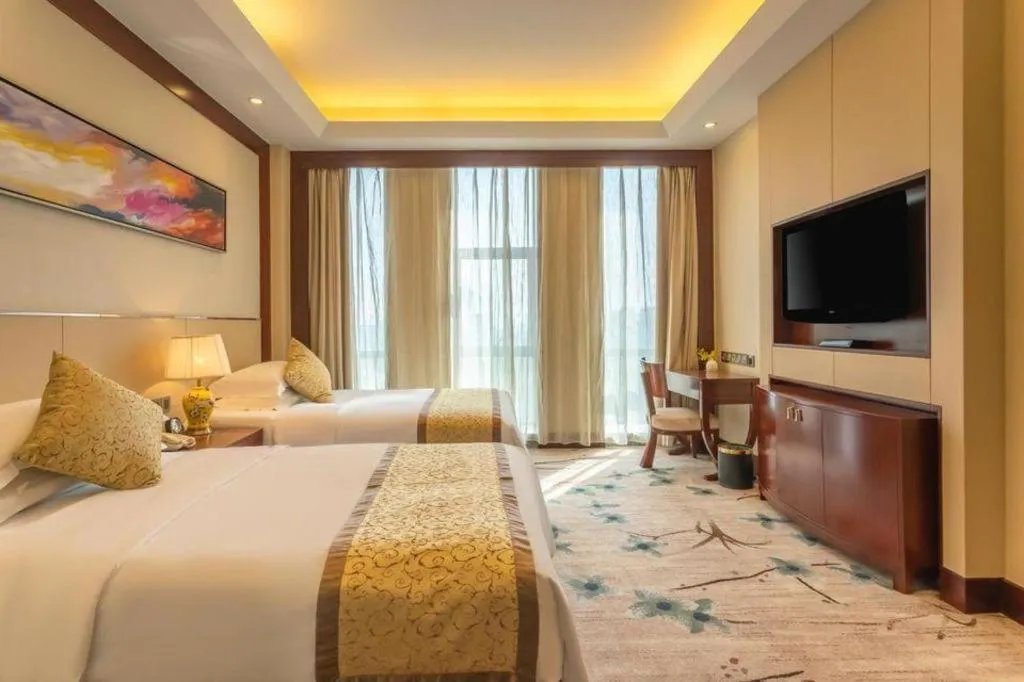 Bed in Dezhou Regal Kangbo Hotel