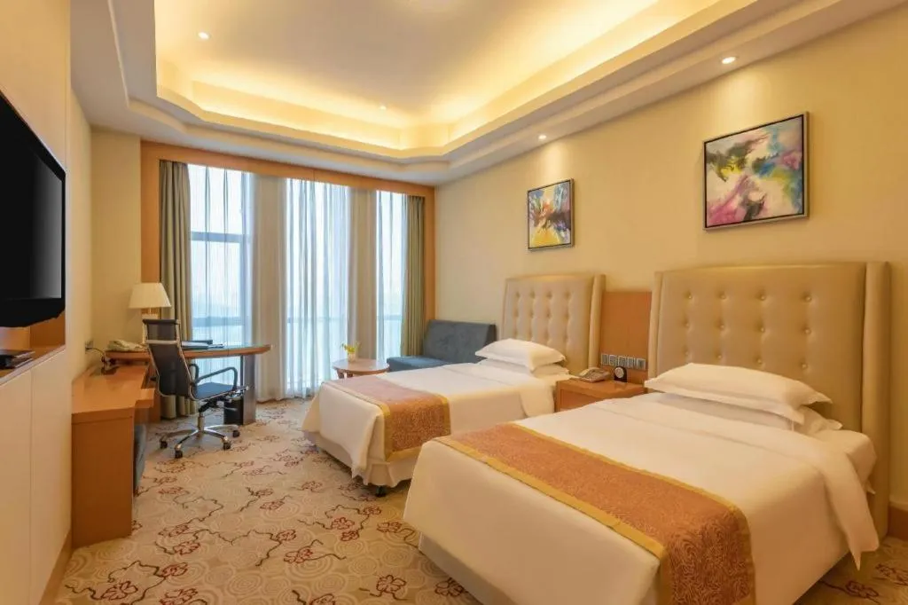 Bed in Dezhou Regal Kangbo Hotel