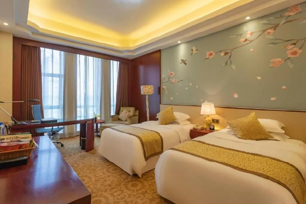 Bed in Dezhou Regal Kangbo Hotel