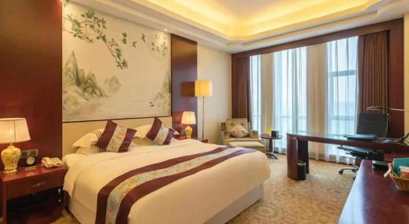 Bed in Dezhou Regal Kangbo Hotel