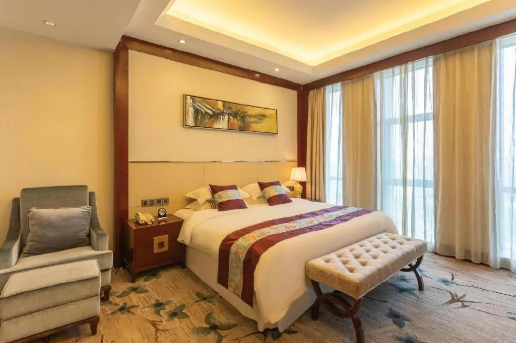 Bed in Dezhou Regal Kangbo Hotel