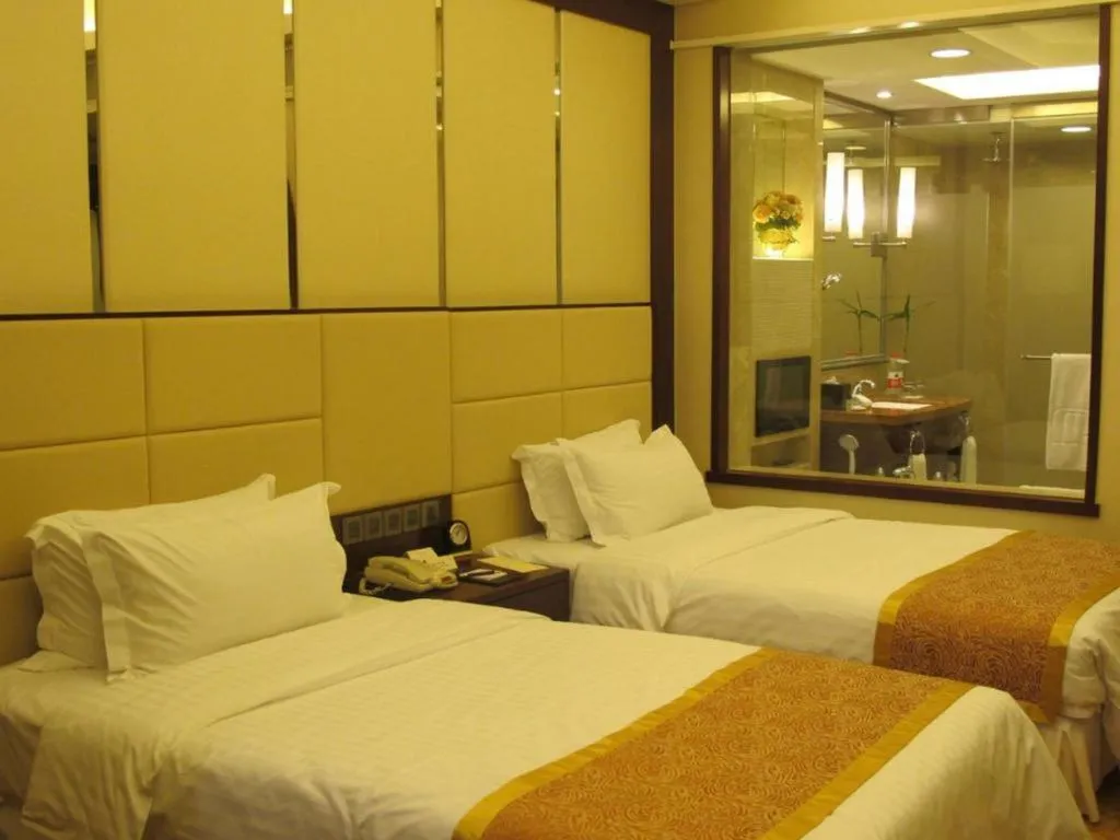 Bed in Dezhou Regal Kangbo Hotel