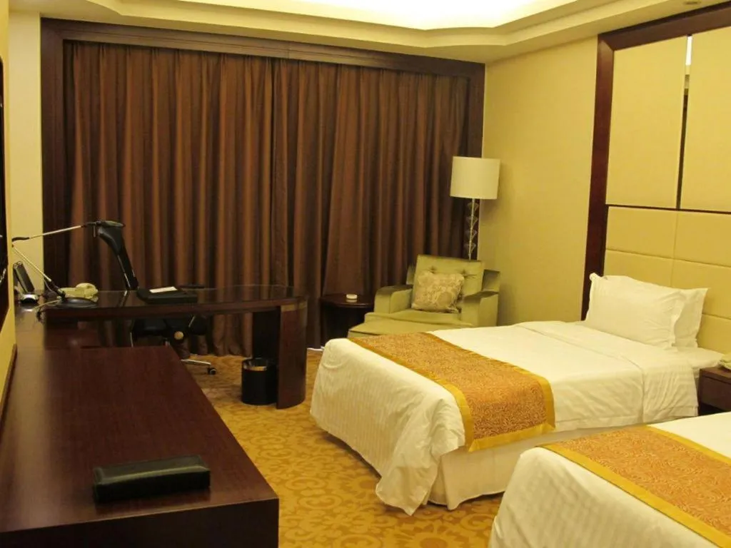 Bed in Dezhou Regal Kangbo Hotel