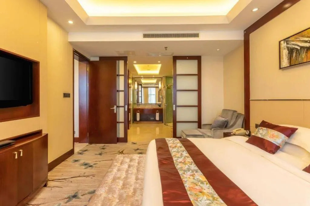 Bed in Dezhou Regal Kangbo Hotel