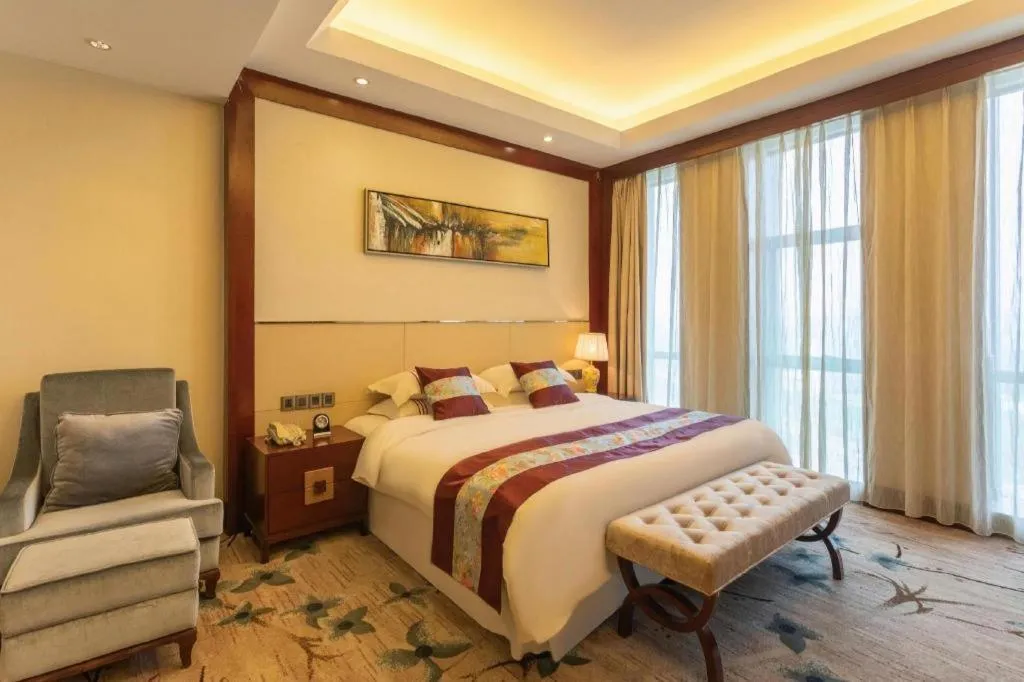 Bed in Dezhou Regal Kangbo Hotel