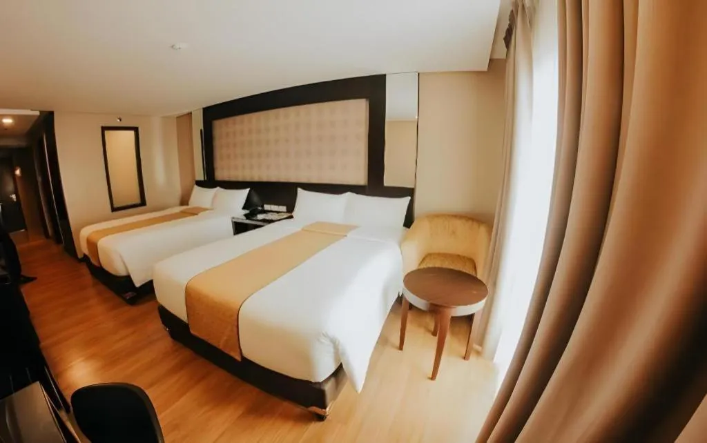 Bed in Grand Xing Imperial Hotel