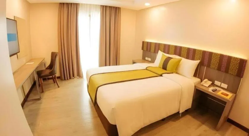 Bed in Grand Xing Imperial Hotel