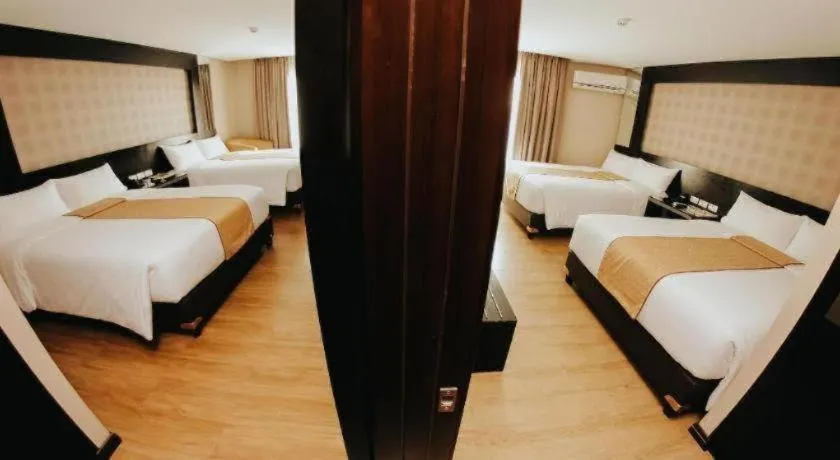 Bed in Grand Xing Imperial Hotel