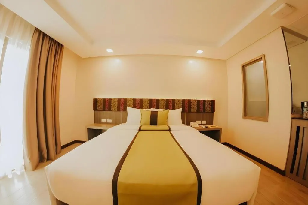 Bed in Grand Xing Imperial Hotel