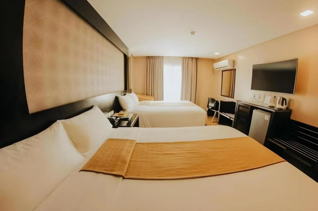 Bed in Grand Xing Imperial Hotel