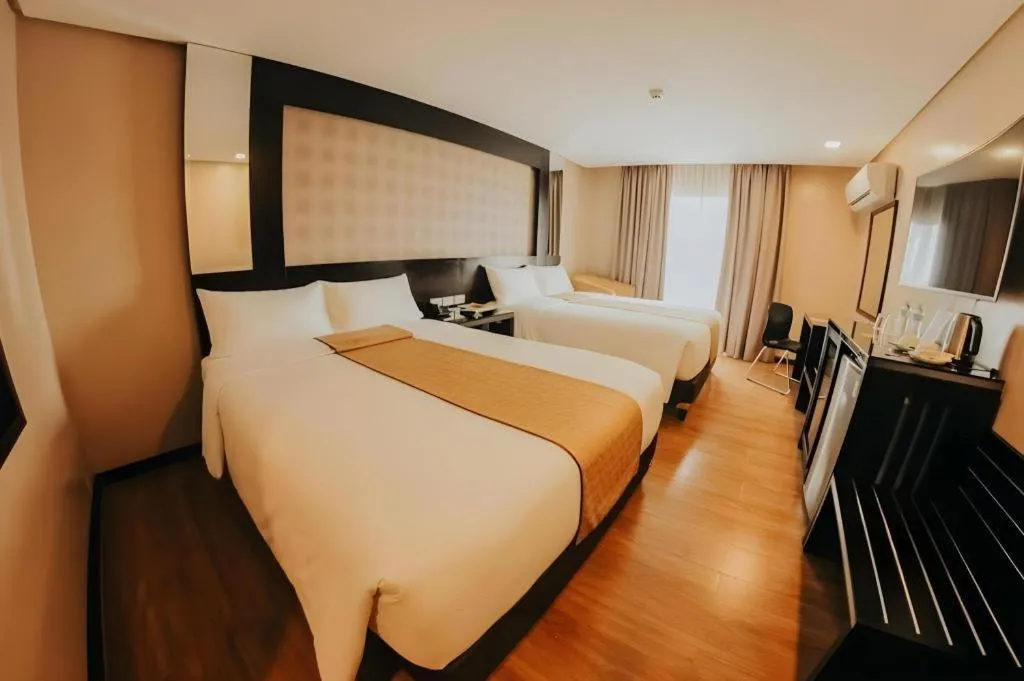 Bed in Grand Xing Imperial Hotel