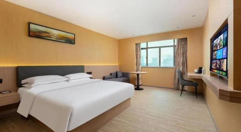 Bed in Borrman Hotel Guangzhou Tianhe Tangdong Subway Station Convention and Exhibition Center