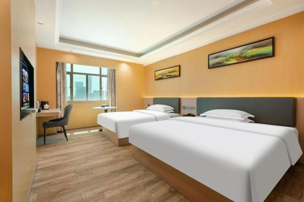 Bed in Borrman Hotel Guangzhou Tianhe Tangdong Subway Station Convention and Exhibition Center