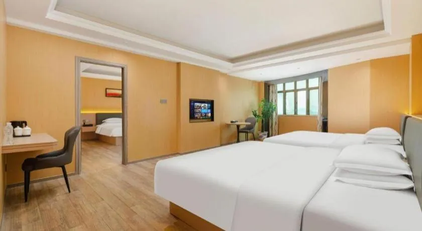 Bed in Borrman Hotel Guangzhou Tianhe Tangdong Subway Station Convention and Exhibition Center
