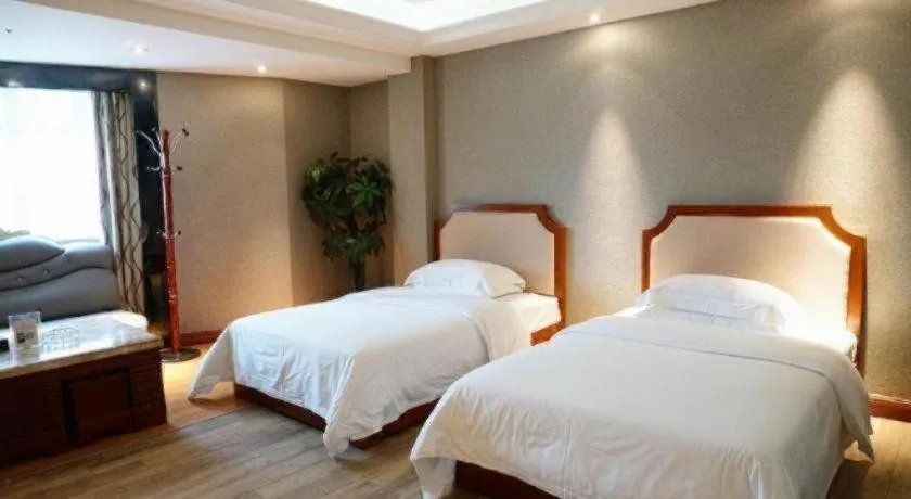 Bed in Borrman Hotel Guangzhou Tianhe Tangdong Subway Station Convention and Exhibition Center