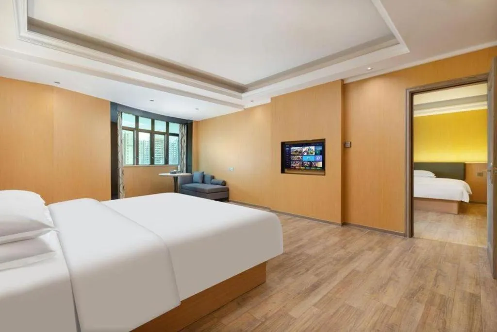 Bed in Borrman Hotel Guangzhou Tianhe Tangdong Subway Station Convention and Exhibition Center