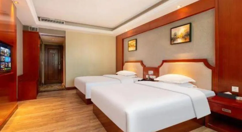 Bed in Borrman Hotel Guangzhou Tianhe Tangdong Subway Station Convention and Exhibition Center