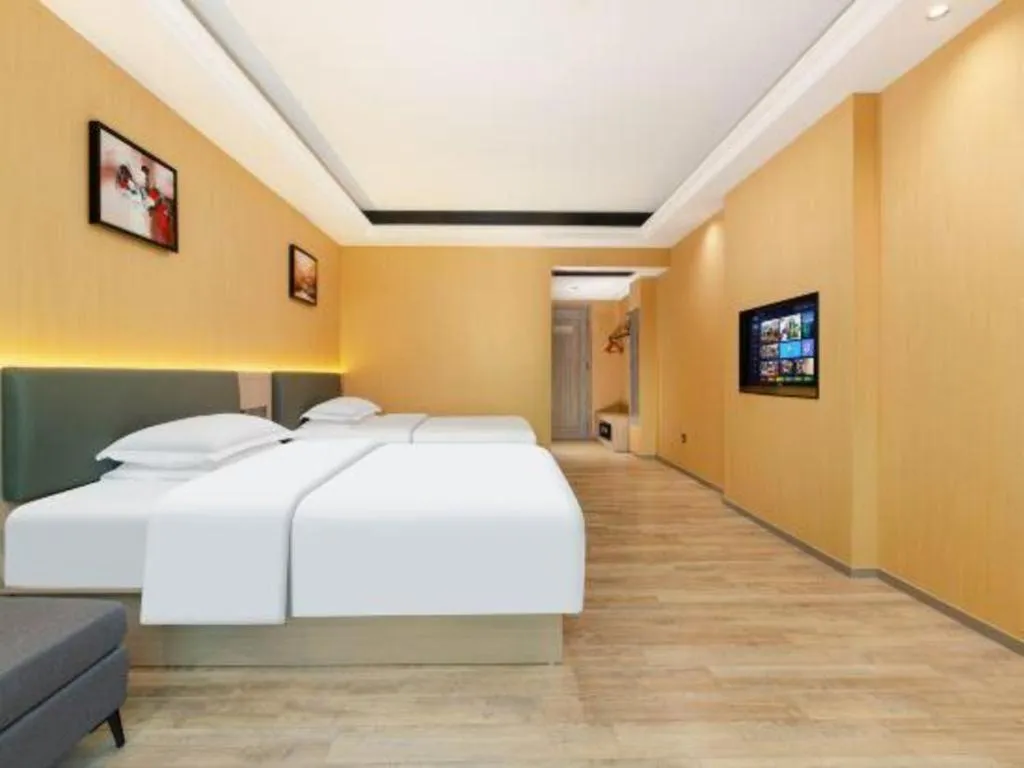 Bed in Borrman Hotel Guangzhou Tianhe Tangdong Subway Station Convention and Exhibition Center