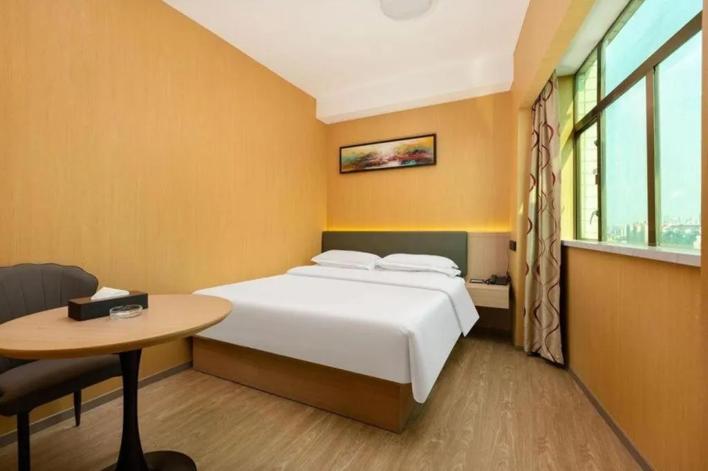 Bed in Borrman Hotel Guangzhou Tianhe Tangdong Subway Station Convention and Exhibition Center