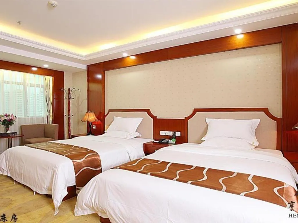 Bed in Borrman Hotel Guangzhou Tianhe Tangdong Subway Station Convention and Exhibition Center