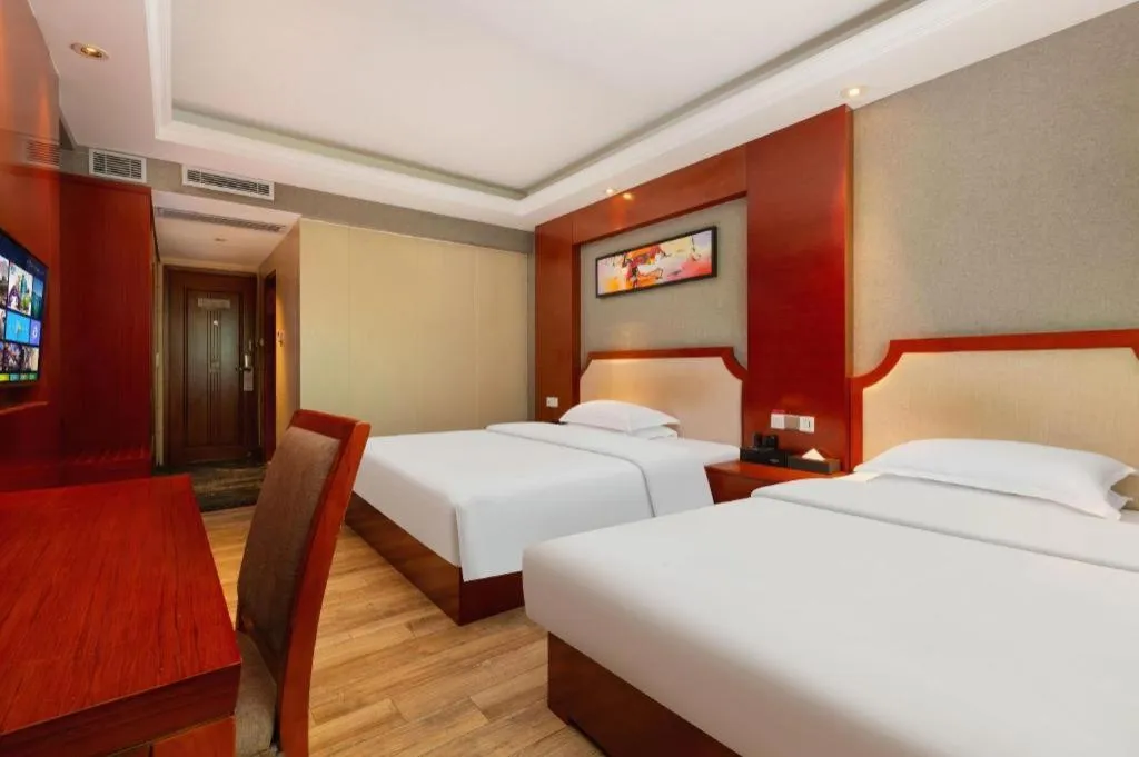 Bed in Borrman Hotel Guangzhou Tianhe Tangdong Subway Station Convention and Exhibition Center