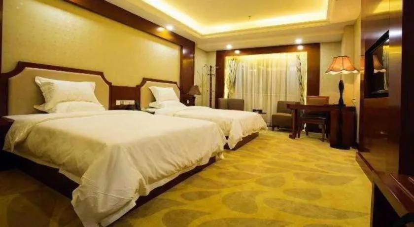 Bed in Borrman Hotel Guangzhou Tianhe Tangdong Subway Station Convention and Exhibition Center