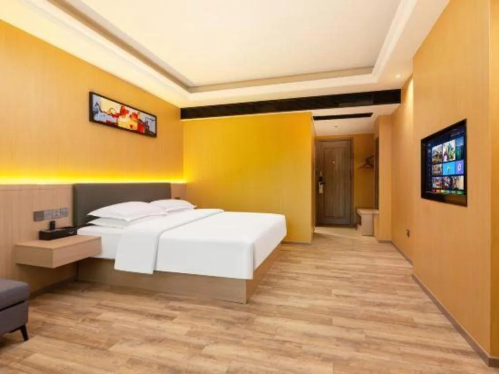 Bed in Borrman Hotel Guangzhou Tianhe Tangdong Subway Station Convention and Exhibition Center