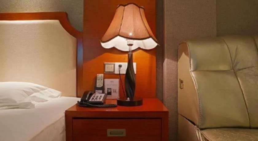 Bed in Borrman Hotel Guangzhou Tianhe Tangdong Subway Station Convention and Exhibition Center