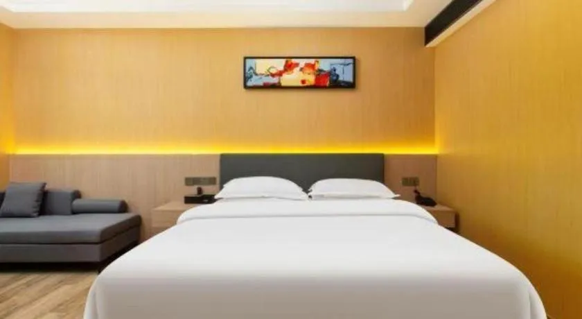 Bed in Borrman Hotel Guangzhou Tianhe Tangdong Subway Station Convention and Exhibition Center