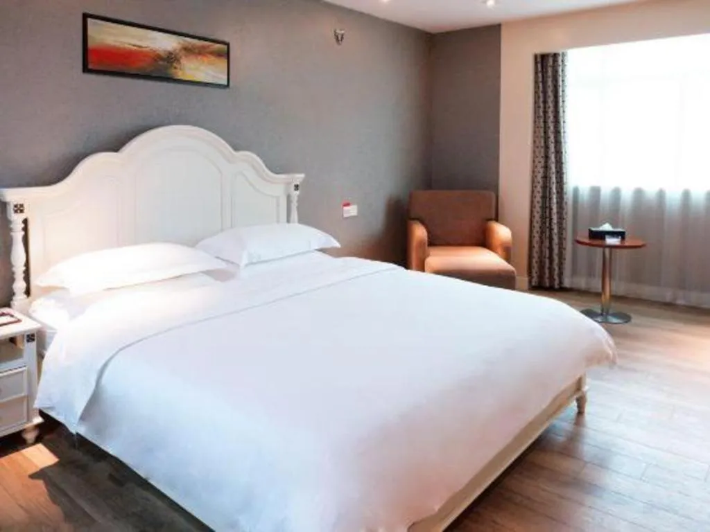 Bed in Borrman Hotel Guangzhou Tianhe Tangdong Subway Station Convention and Exhibition Center