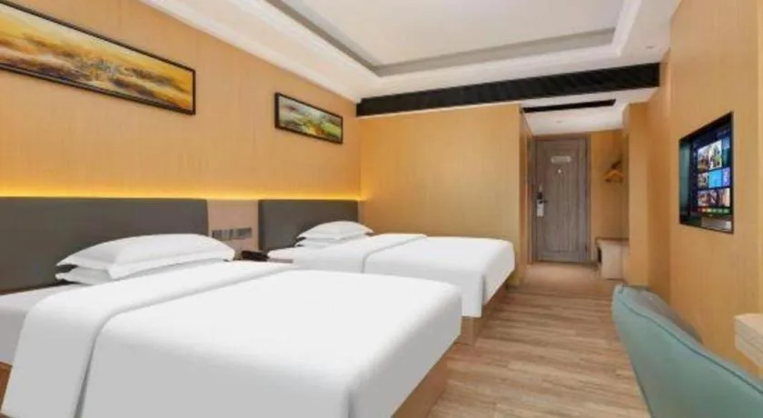 Bed in Borrman Hotel Guangzhou Tianhe Tangdong Subway Station Convention and Exhibition Center