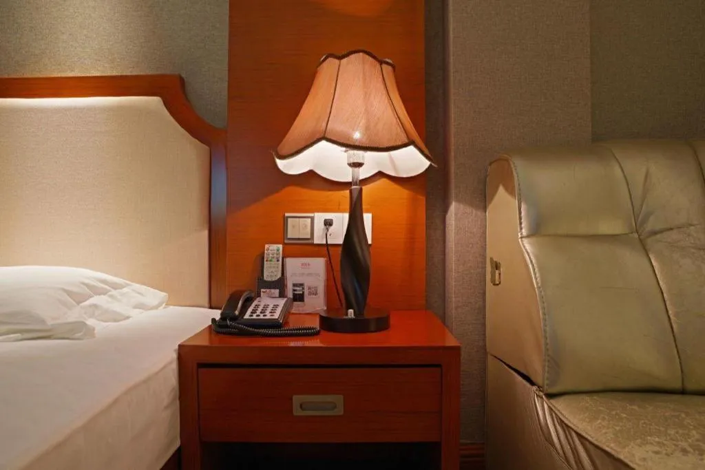 Bed in Borrman Hotel Guangzhou Tianhe Tangdong Subway Station Convention and Exhibition Center