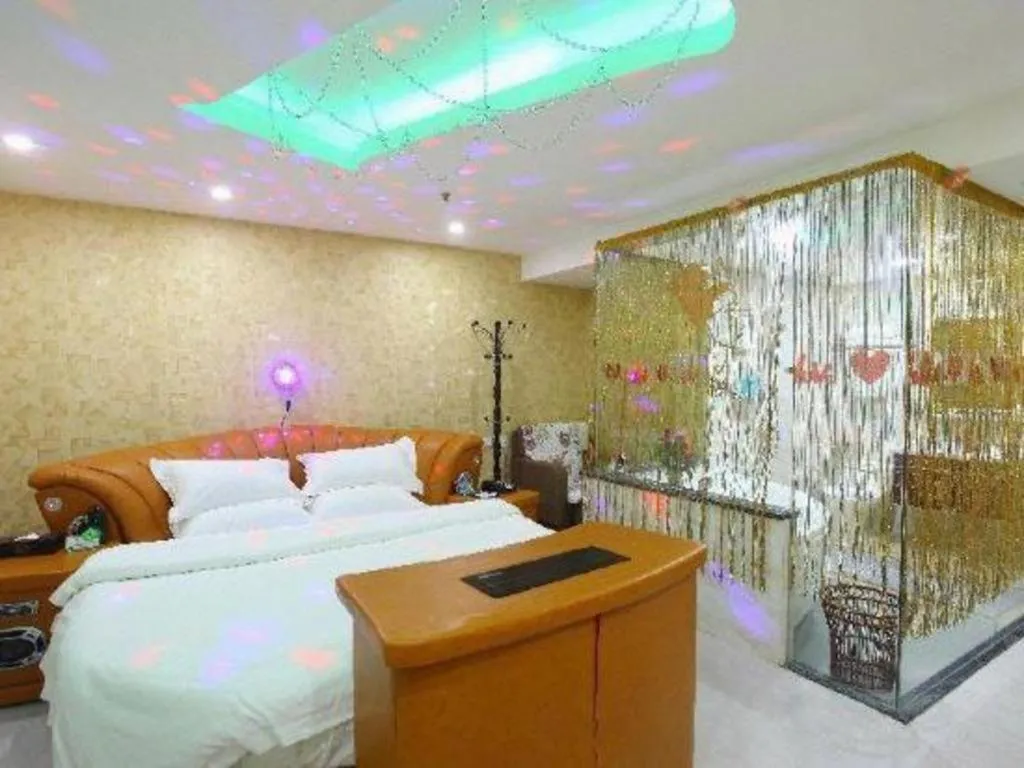 Bed in Borrman Hotel Guangzhou Tianhe Tangdong Subway Station Convention and Exhibition Center