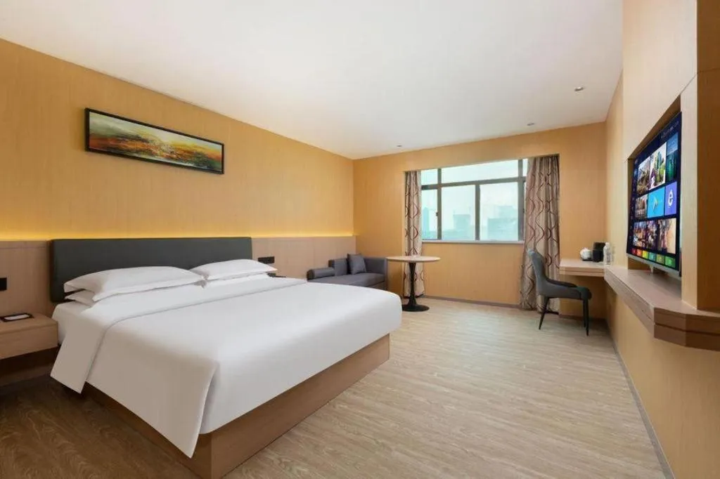 Bed in Borrman Hotel Guangzhou Tianhe Tangdong Subway Station Convention and Exhibition Center