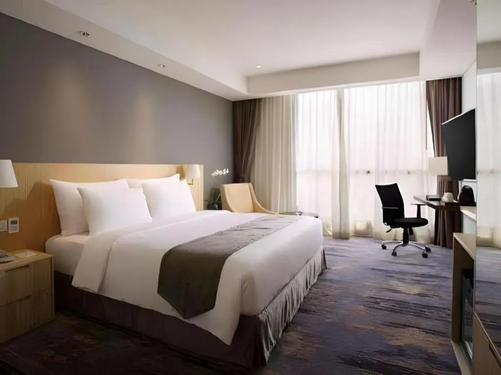 Bed in Hotel Grandhika Pemuda