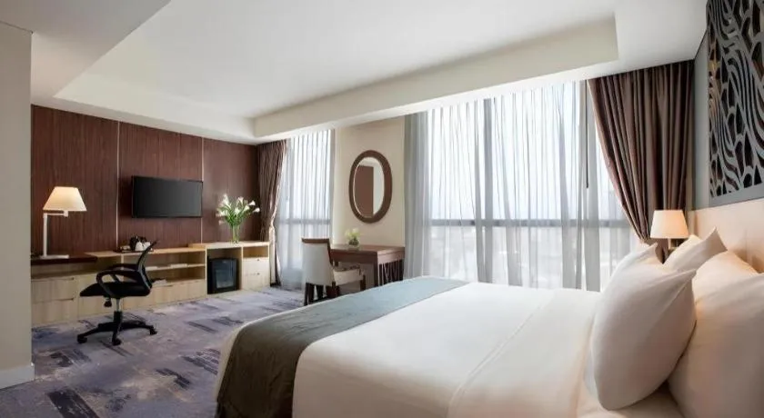 Bed in Hotel Grandhika Pemuda