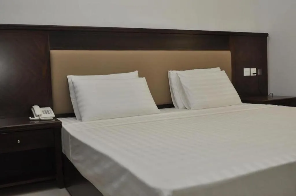Bed in Sai Sea City Hotel