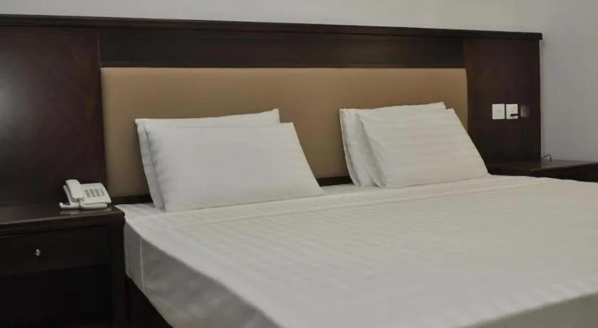 Bed in Sai Sea City Hotel