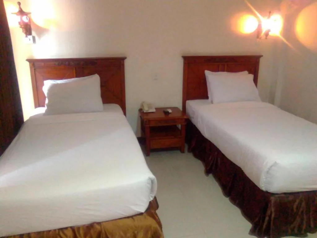 Bed in Yusro Hotel Restaurant & Convention