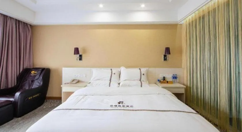 Bed in Chuanghui Business Hotel