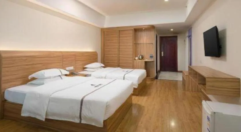 Bed in Chuanghui Business Hotel