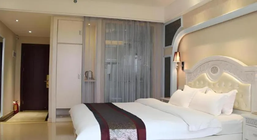 Bed in Chuanghui Business Hotel