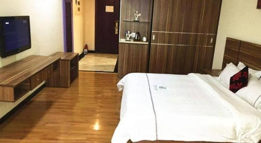 Bed in Chuanghui Business Hotel