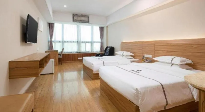 Bed in Chuanghui Business Hotel