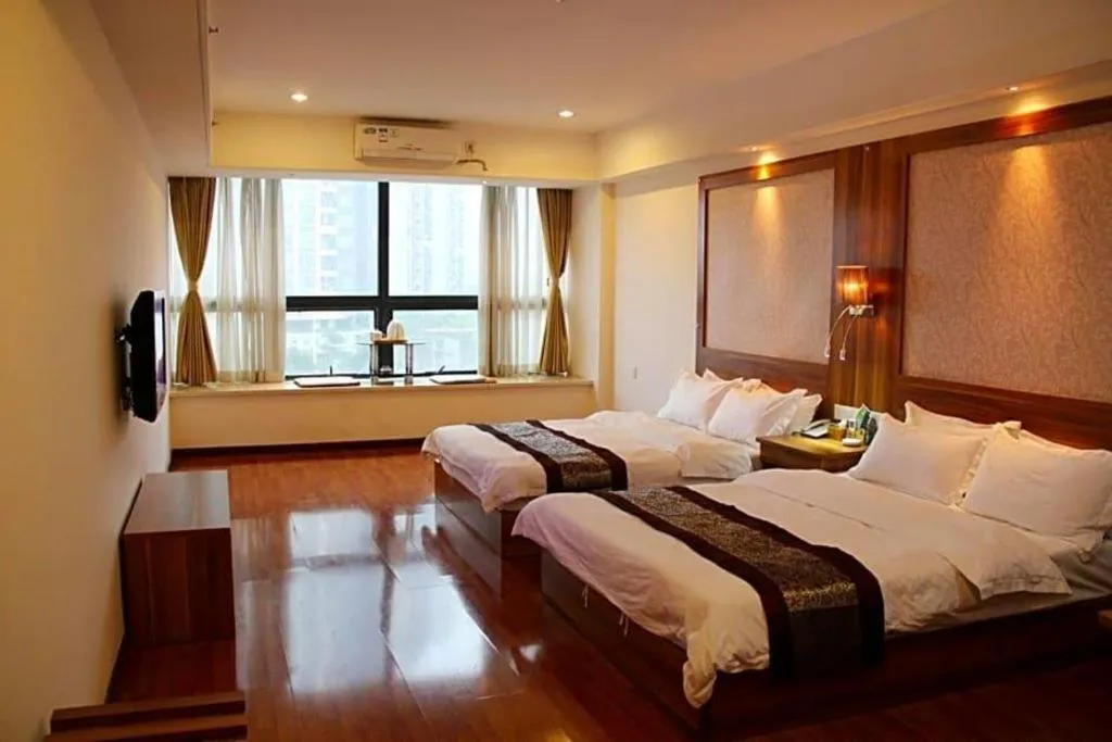 Bed in Chuanghui Business Hotel