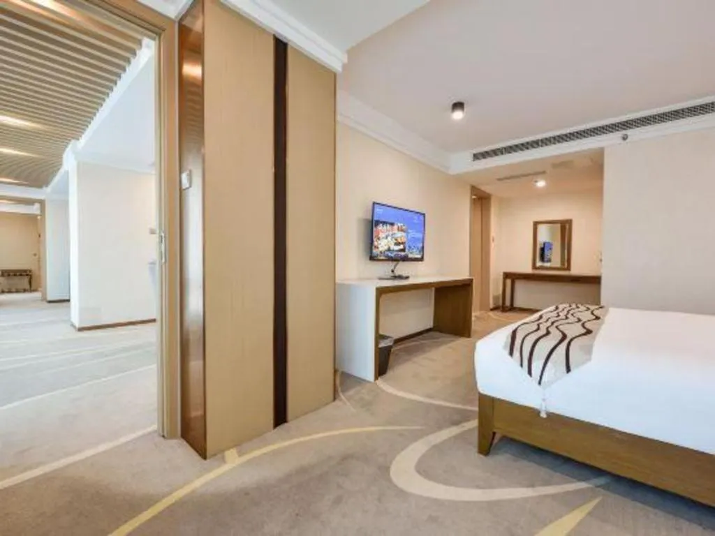 Bed in Dalian Bohai Pearl Hotel