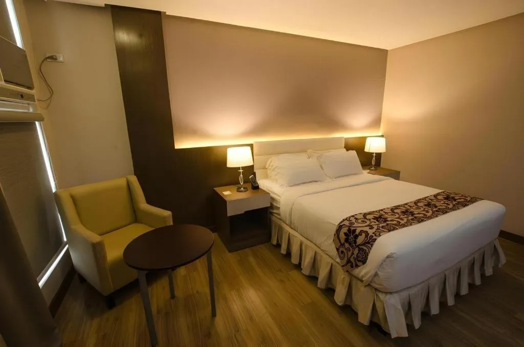 Bed in Oryza Hotel