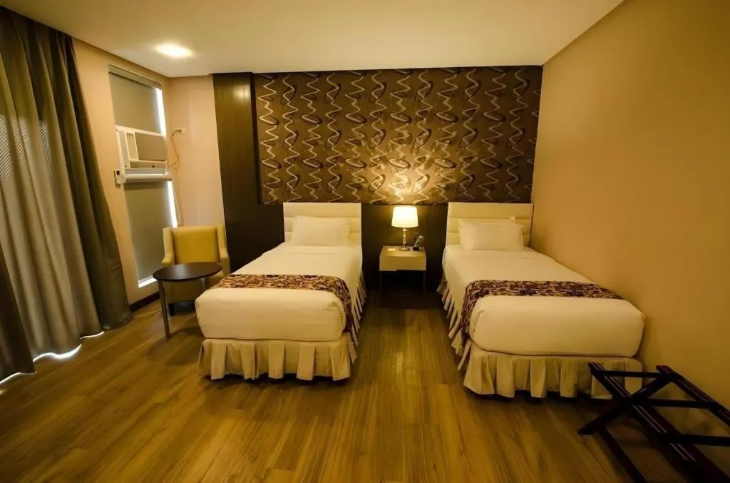 Bed in Oryza Hotel